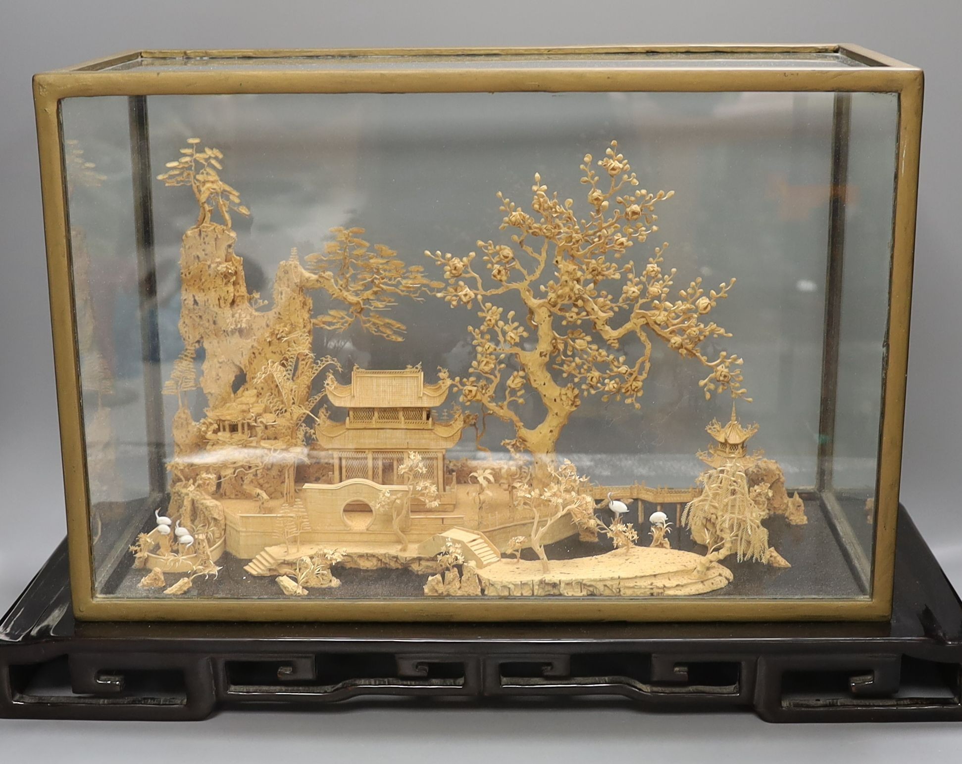 A large Chinese export Ruanmu Hua carved cork diorama, depicting a pagoda on stand - 35.5cm tall including case